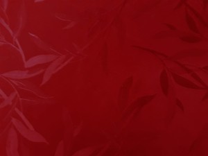 TKANINA ZASŁONOWA W KOLORZE BORDOWYM Z WYTŁACZANYMI  LISTKAMI W TYM SAMYM KOLORZE SZEROKOŚĆ 160 CM PRODUCENT POLONTEX CZĘSTOCHOWA