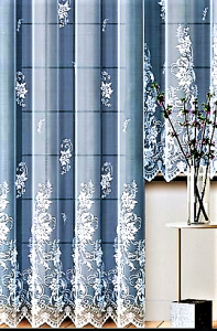 NIEZWYKLE STYLOWA FIRANKA Z BIAŁEGO ŻAKARDU Z PIĘKNYM WZOREM FLORYSTYCZNYM NA CAŁEJ POWIERZCHNI I BOGATO OZDOBIONYM DOŁEM WYSOKOŚĆ 250 CM 300 CM PRODUCENT HAFT KALISZ